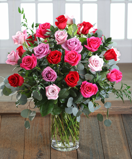 Farm-fresh luxury 'Love & Romance' Ecuadorian Mountain Roses featuring our 30% Larger Red, Pink, and Hot Pink Colors in a chic vase.