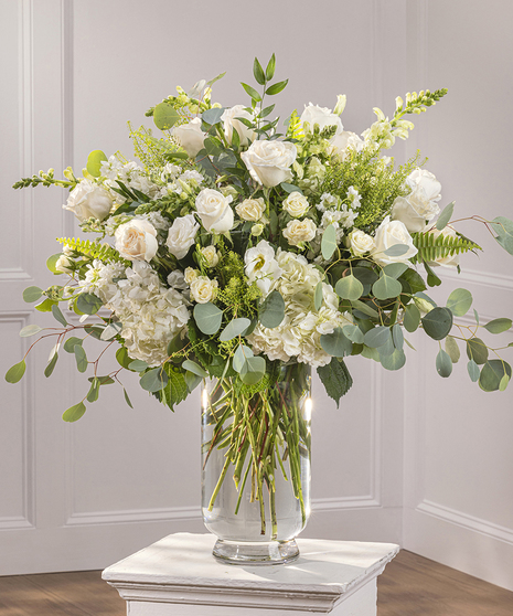 Event Bohemian Pedestal Arrangement in our bloom on bloom style in your choice of color palette.