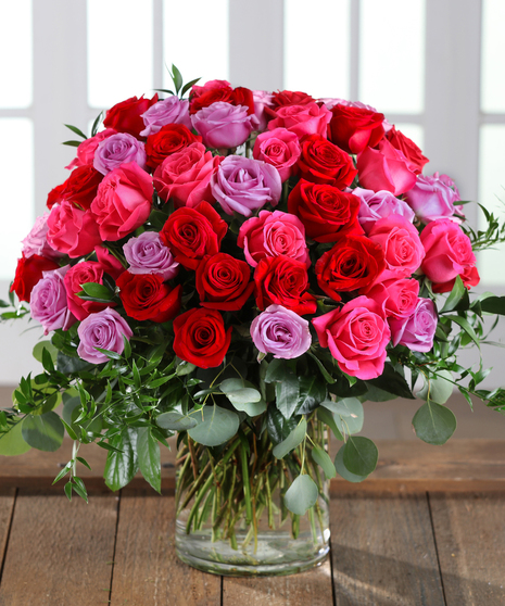 Farm-fresh luxury 'Love & Romance' Ecuadorian Mountain Roses featuring our 30% Larger Red, Pink, and Hot Pink Colors in a chic vase.